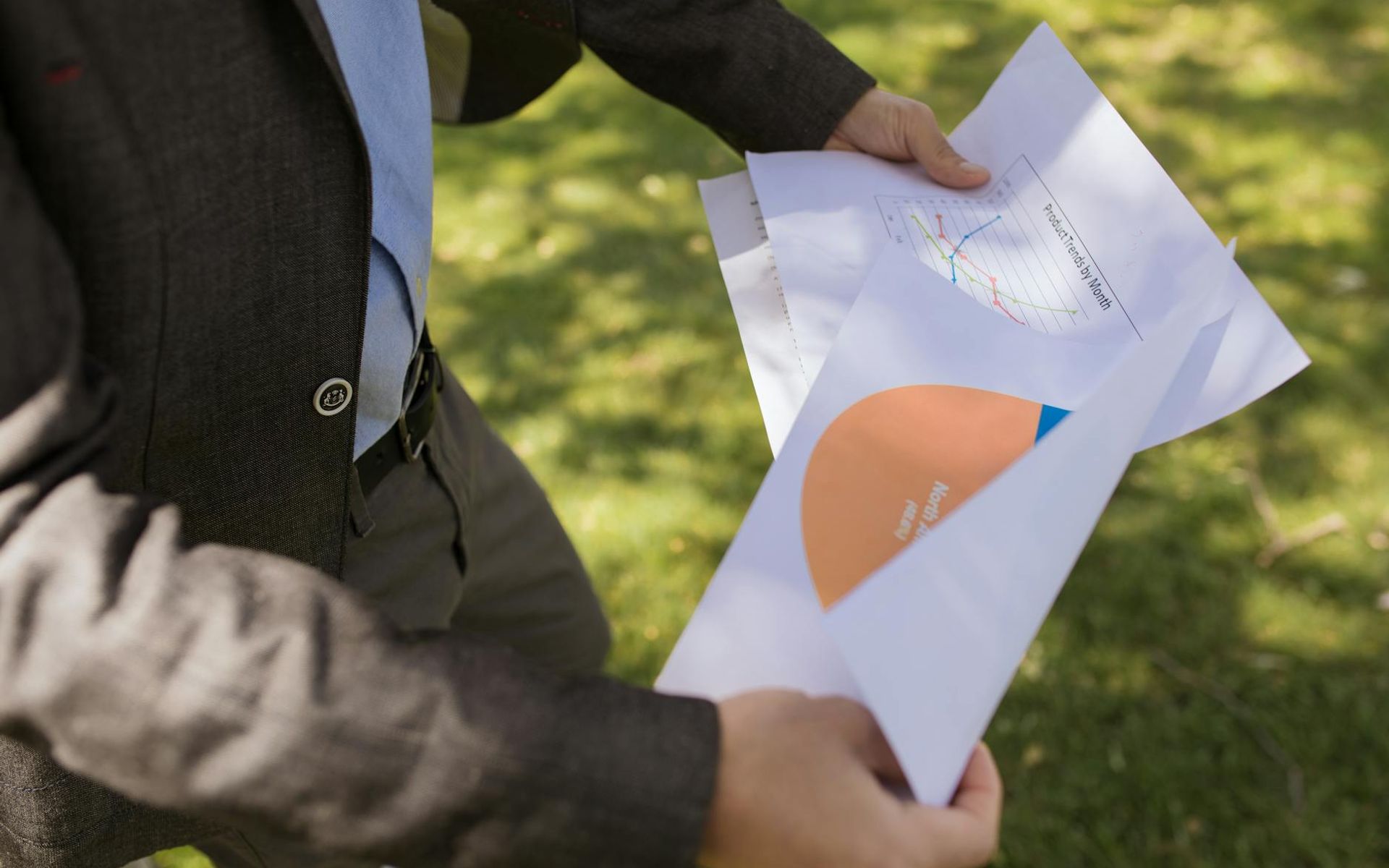 Close-up of investment analyst reviewing portfolio performance metrics