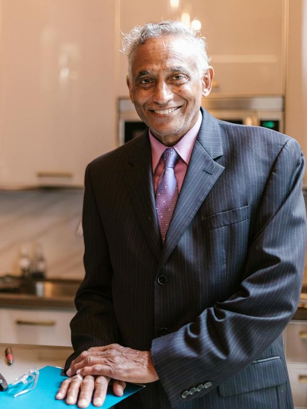 Man in professional business attire working as senior investment analyst